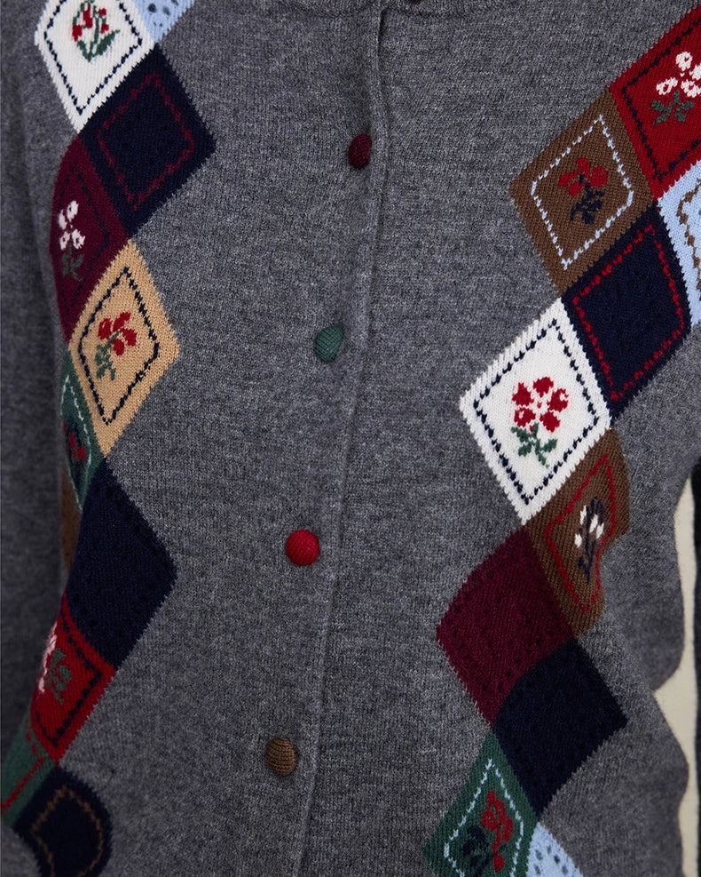 Side and hem detail of VIONIS XY heather grey merino wool cardigan with intarsia knit texture
