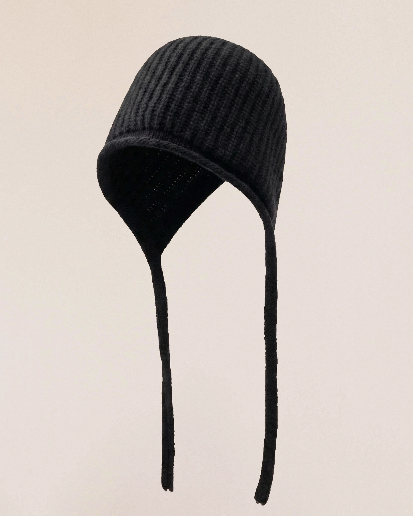 VIONIS·XY merino tie-bonnet flat lay, minimalist presentation in 100% 16S merino wool with elongated ties black