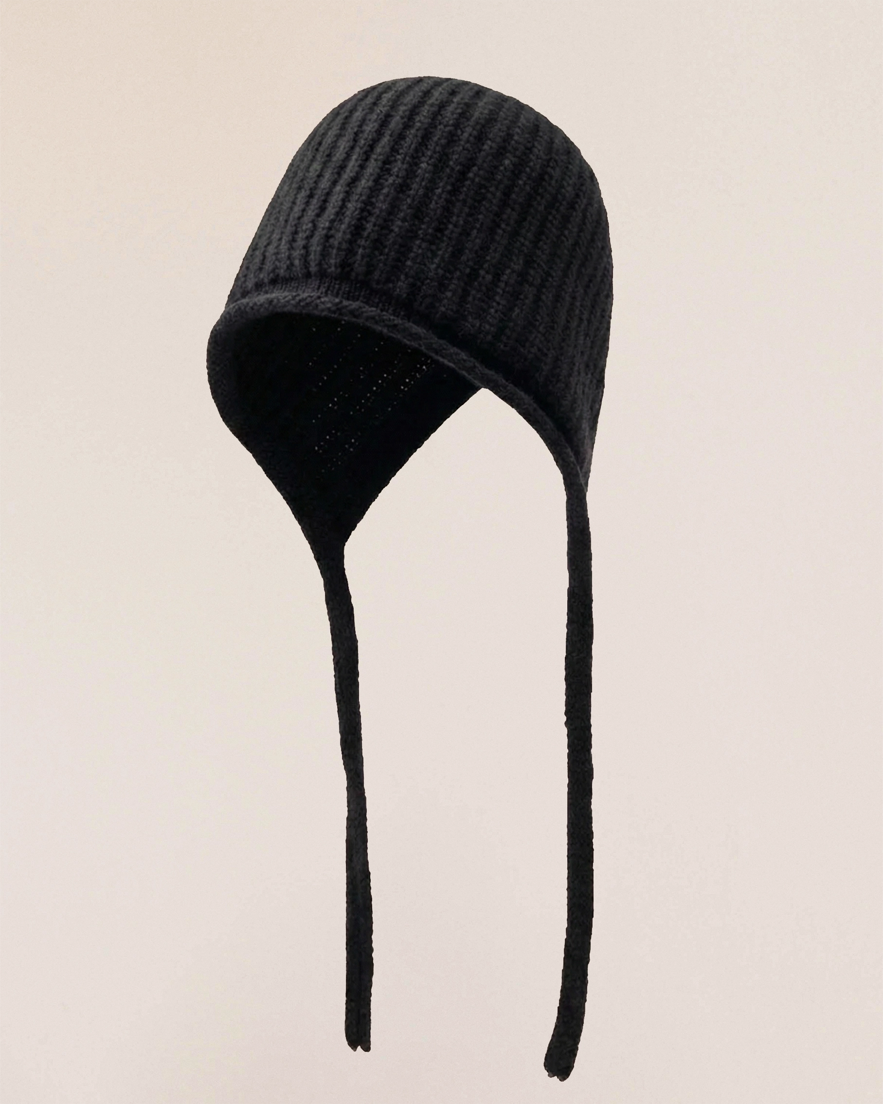 VIONIS·XY merino tie-bonnet flat lay, minimalist presentation in 100% 16S merino wool with elongated ties black