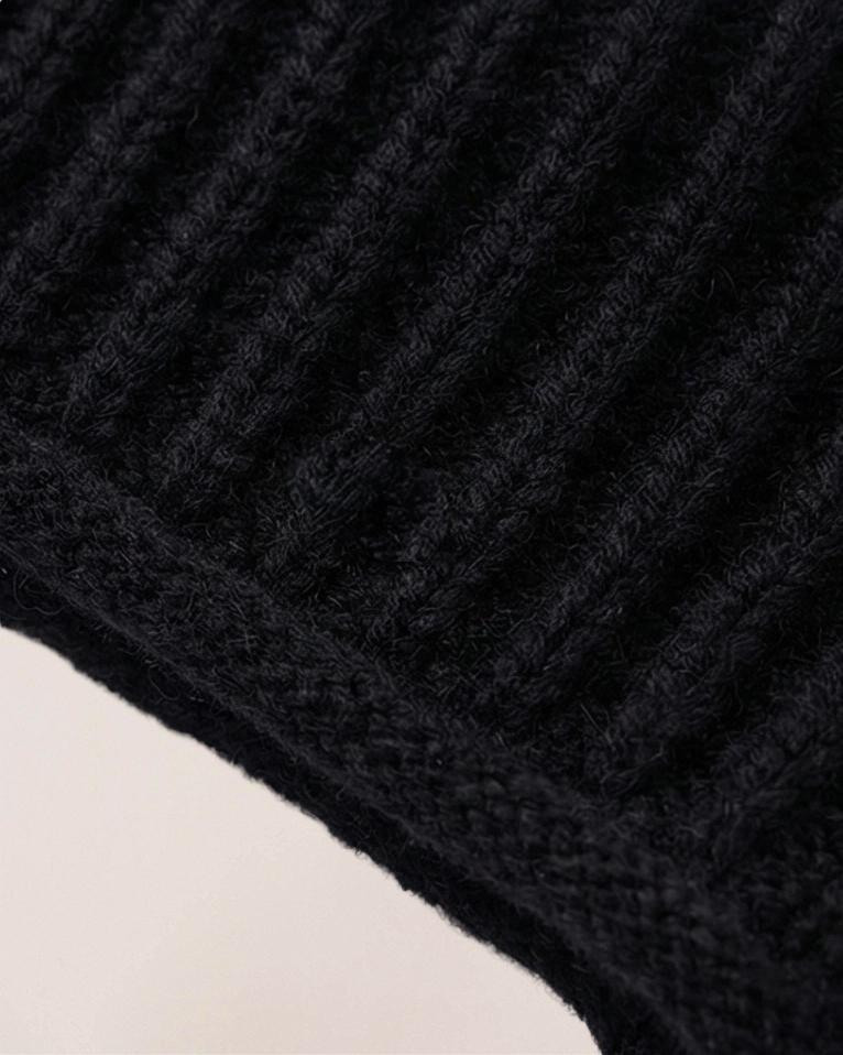 Close-up of VIONIS·XY black merino wool texture, ultra-fine 16S yarn with soft cashmere-like feel black